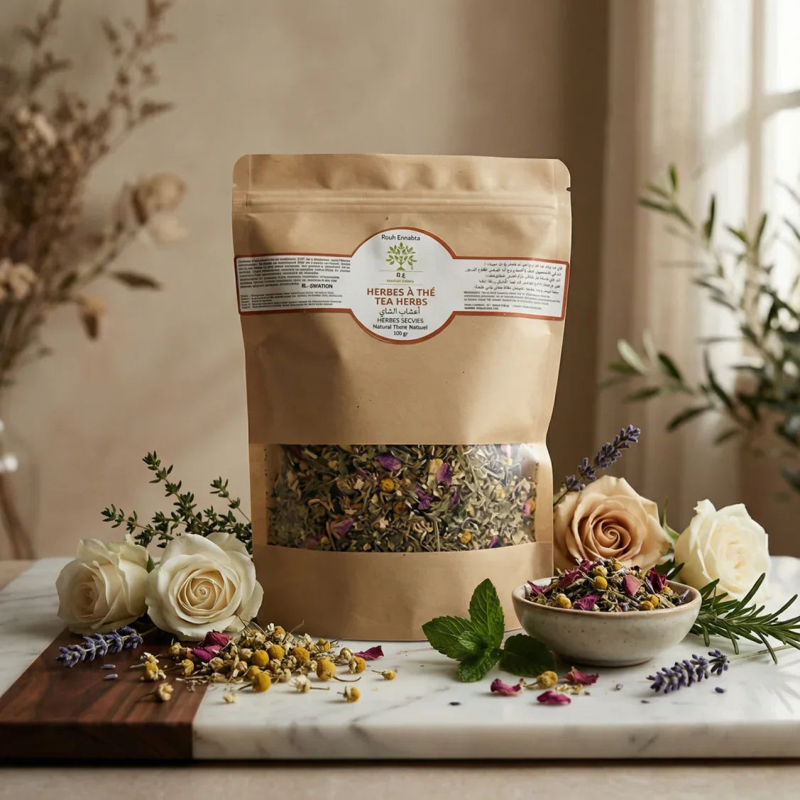 Herbes à Thé BIO – Mélange Détox Beauté loose tea blend with herbs in kraft paper pouch surrounded by flowers and leaves