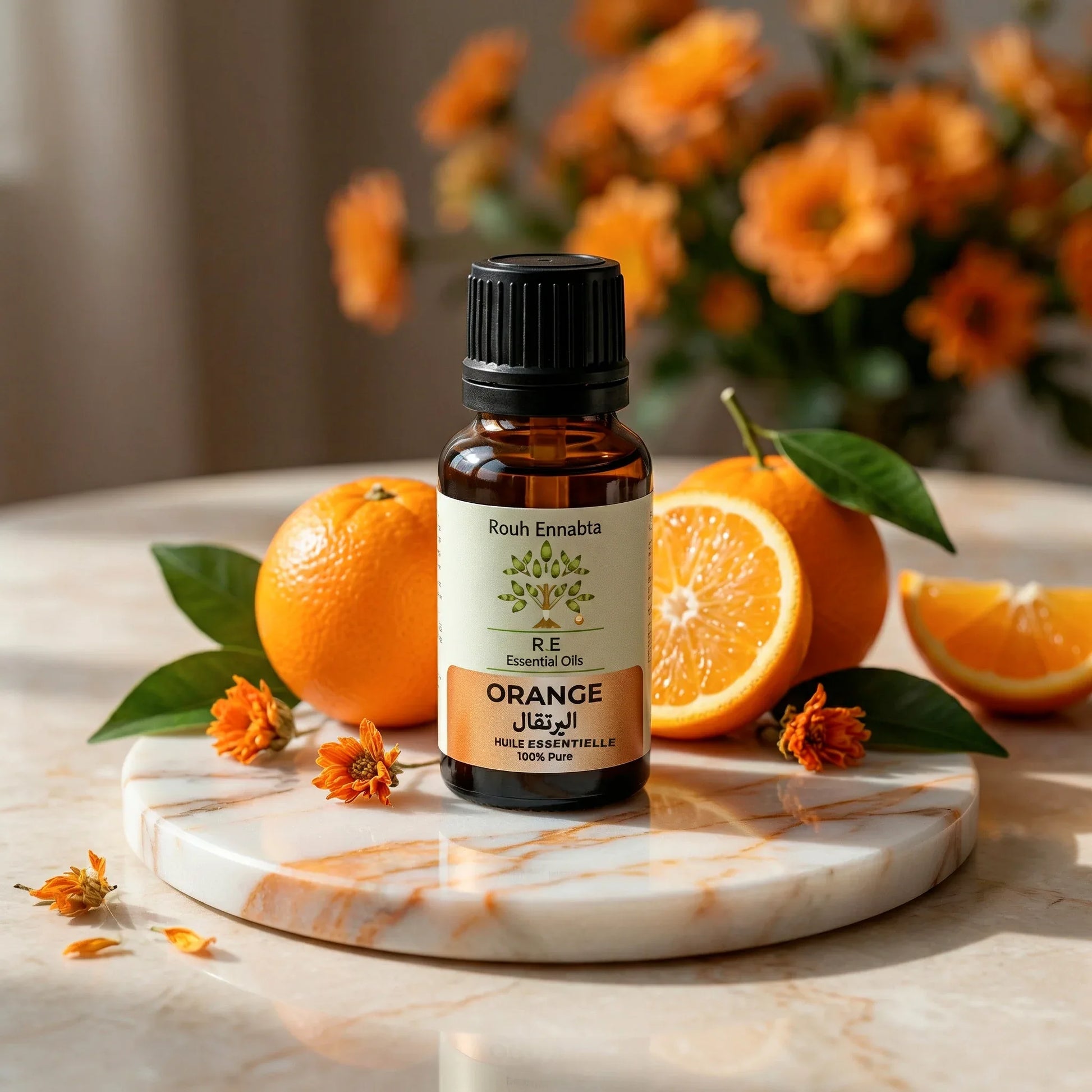 Huile Essentielle Orange Douce BIO | Éclat du teint & sérénité with a bottle and fresh oranges on marble surface