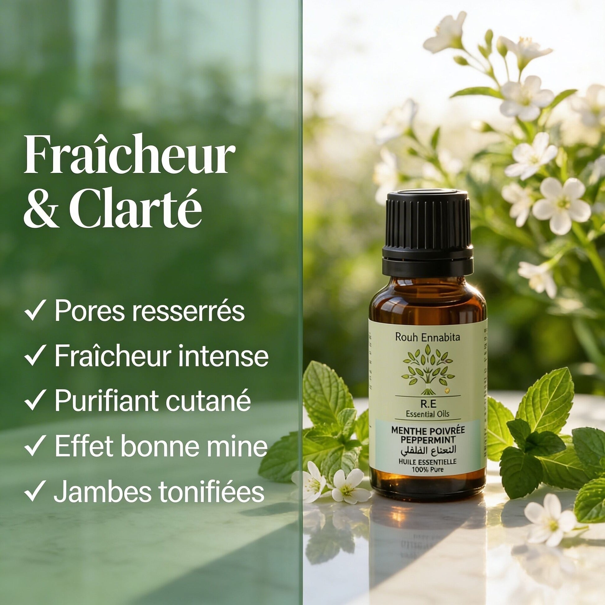 Bottle of Huile Essentielle de Menthe Poivrée BIO – Fraîcheur & Clarté essential oil with white flowers and green leaves in the background
