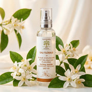 Flacon spray d'eau de fleurs d'oranger bio Jodhur sur marbre avec fleurs blanches — tonique multi-usage Maroc